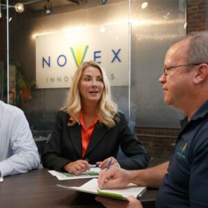 Novex's leadership discussing a project